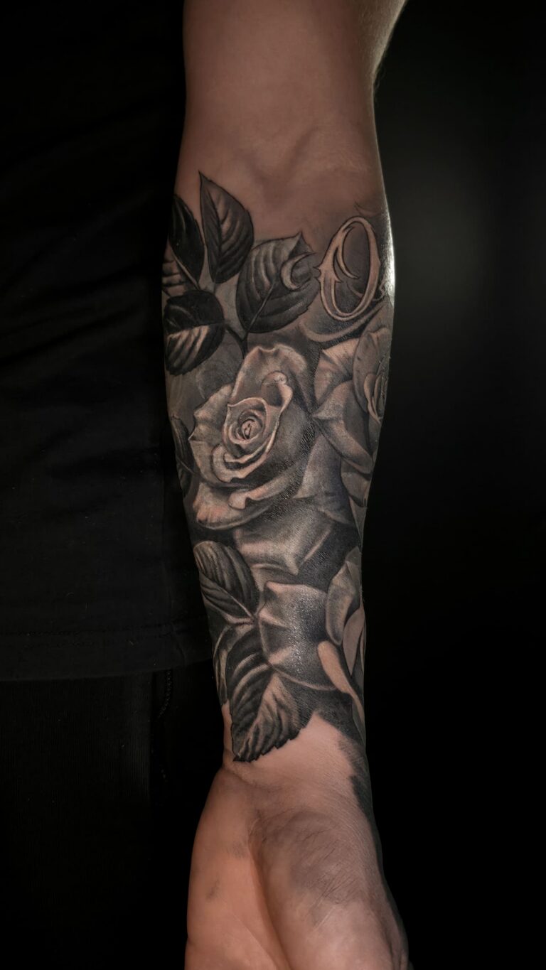 Rose cover up tattoo in black and grey style – detailed petals and shading, tattoo transformation in Tallinn